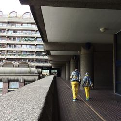 View of woman walking on tiled floor