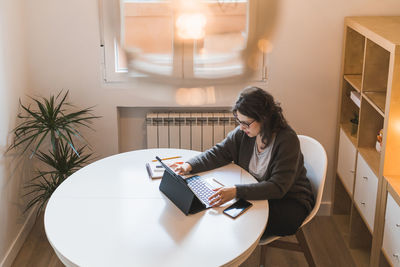 White woman working from home