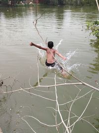 Rear view of man in lake