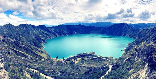 Scenic view of lake against cloudy sky