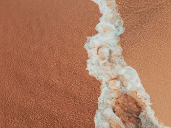 Sand and sea foam