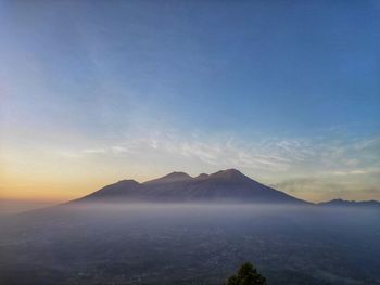 Scenic view of mountains against sky during sunset
