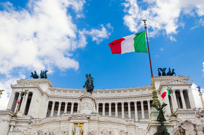 Italian flag on vittoriano building. rome, italy. this monument is landmark of italy.