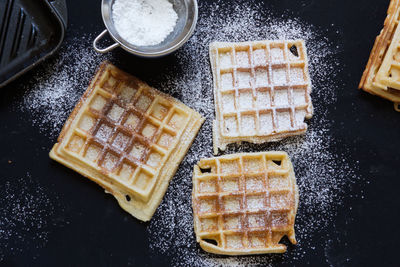 High angle view of waffles with icing on table