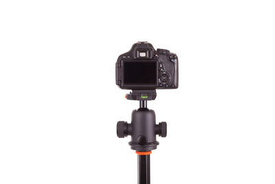 Low angle view of camera against white background