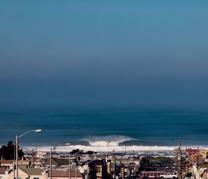 Panoramic view of beach against blue sky