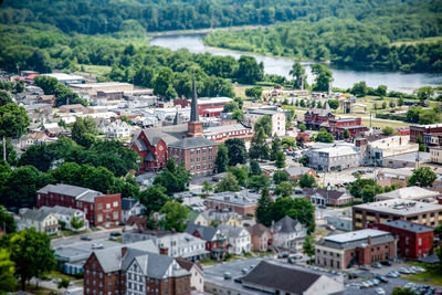 Tilt-shift image of trees and houses in city