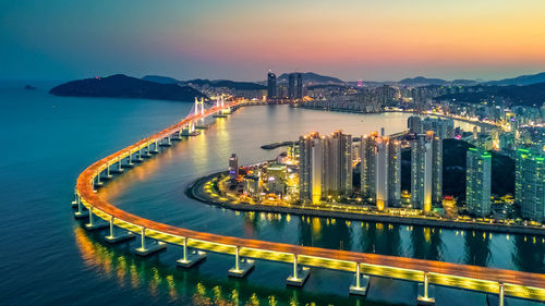 Aerial view busan gwangan daegyo bridge skyline and skyscraper illuminated, busan, south korea.
