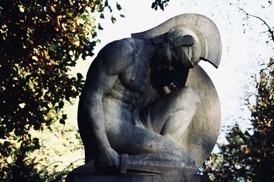 Low angle view of statue against sky