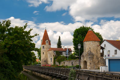 Panoramic view of temple amidst buildings against sky