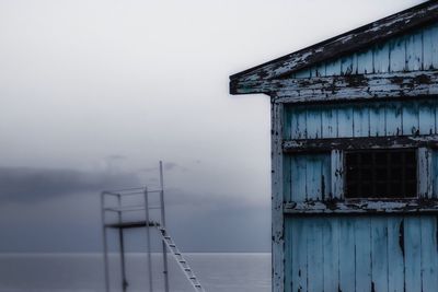 Beach hut against sea