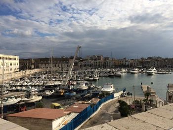 High angle view of boats moored at harbor