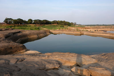 Scenic view of rocks against sky