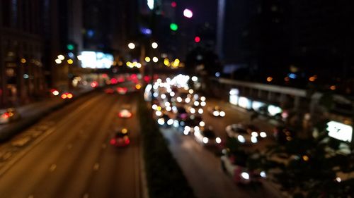 Defocused image of traffic on city street at night