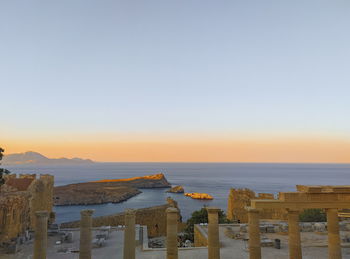 Scenic view of sea against clear sky during sunset