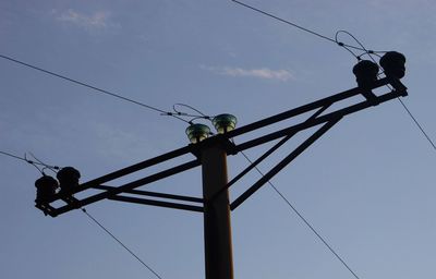 Low angle view of power line against sky