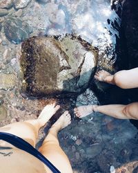 Low section of woman in water