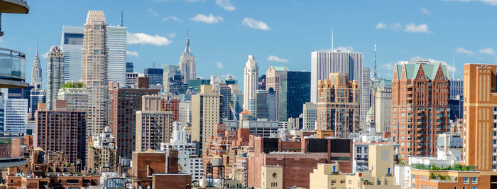 Modern buildings in city against sky