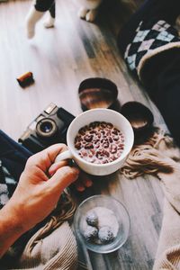 Woman holding coffee cup