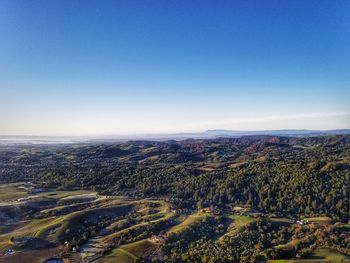 Scenic view of landscape against clear blue sky