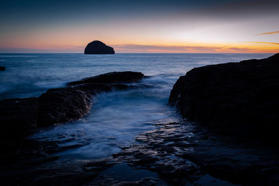 Scenic view of sea against sky during sunset