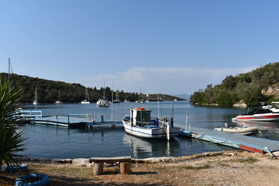 Boats moored at harbor