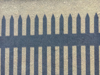 Full frame shot of fence with shadow