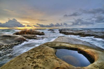 Scenic view of sea against sky during sunset