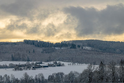 Scenic view of snow covered landscape against sky