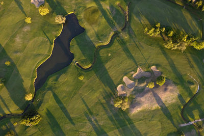 Aerial photographic documentation of a golf course taken at sunset