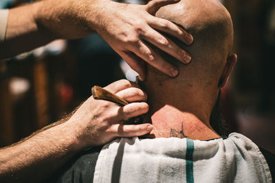 Close-up of man holding hands