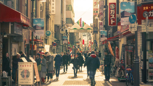 People walking on street in city