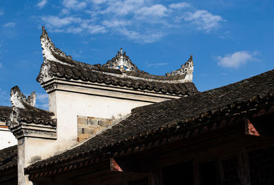 Low angle view of temple building against sky