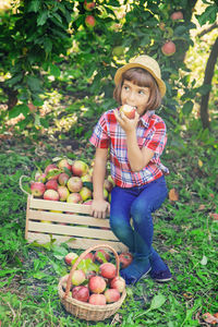 Portrait of cute girl picking apples