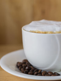 Close-up of coffee cup on table