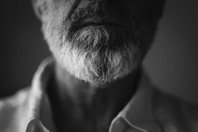 Close-up of man against black background