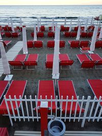 Red chairs on beach