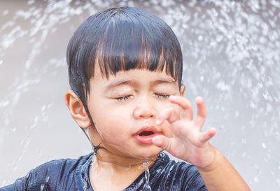 Portrait of young woman with eyes closed