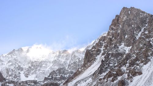 Scenic view of snow mountains against sky
