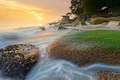 Scenic view of sea against sky at sunset