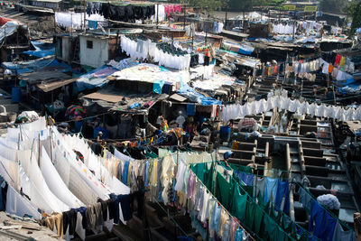 Clothes drying by slum at laundry