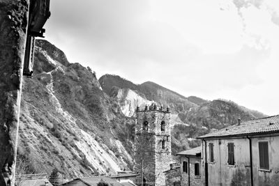 Panoramic view of buildings and mountains against sky