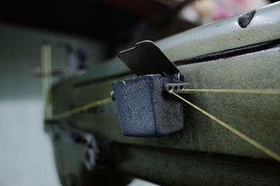 Close-up of rope tied on metal railing