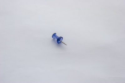 High angle view of electric lamp against white background