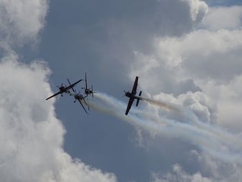 Low angle view of airplane against sky