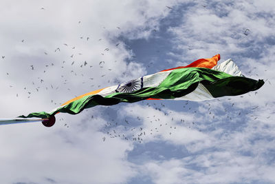 Low angle view of flag against sky