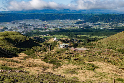 Scenic high angle view on aso town, abandoned buildings, and walk way from mountain aso
