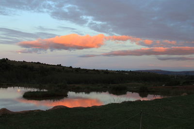 Scenic view of lake against sky during sunset