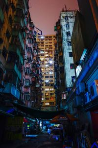 Low angle view of illuminated buildings at night