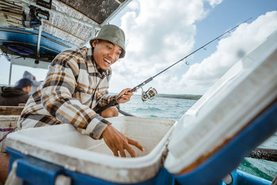 Portrait of man sitting on boat